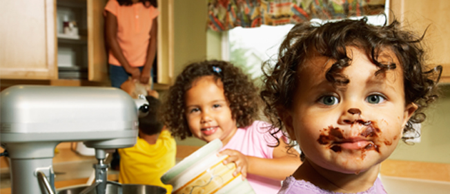 Closeup of toddler with chocolate all over her mouth